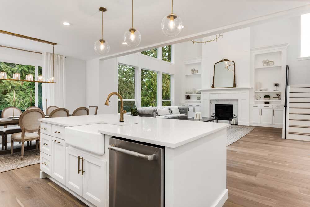 Clean white living room with kitchen island sink