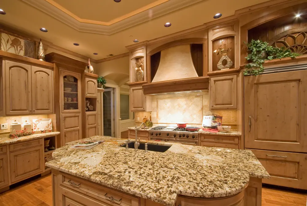 Spacious Calabasas kitchen remodel with wood cabinetry and central island sink