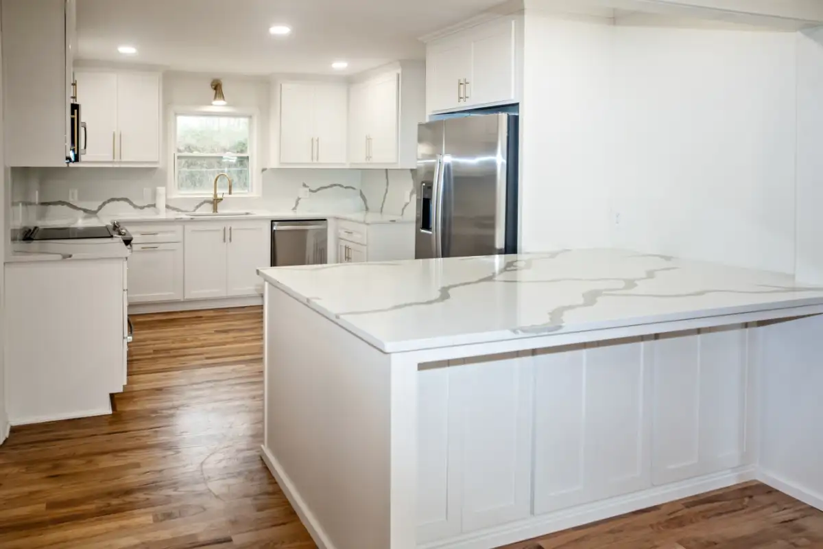 Bright Newly Remodeled White Kitchen With Quartz Countertops